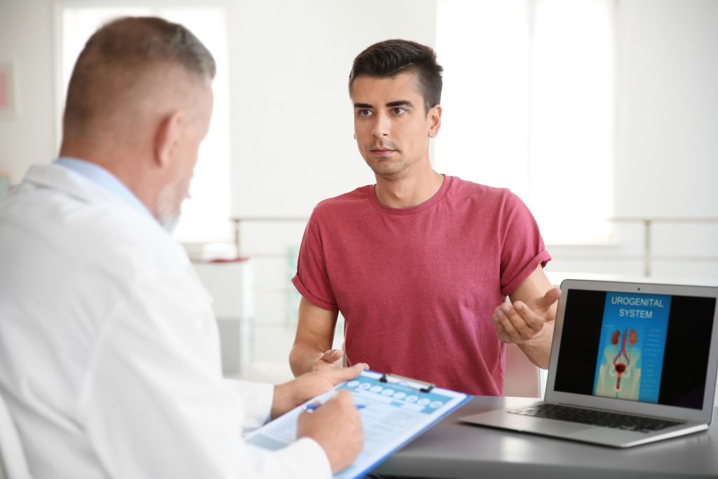 man discussing treatment options with doctor