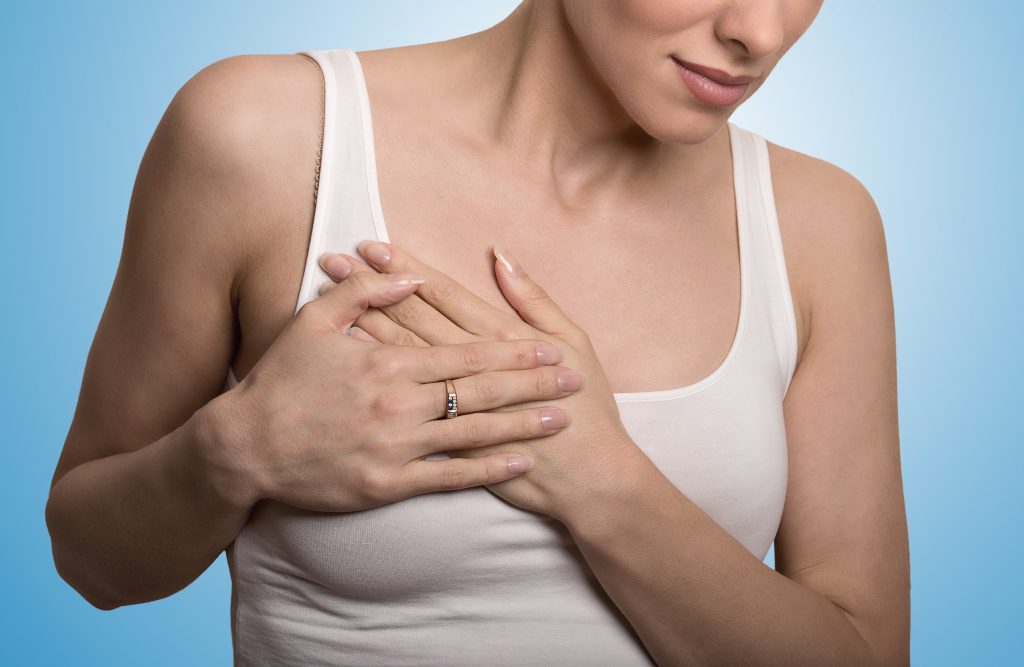 woman in breast pain